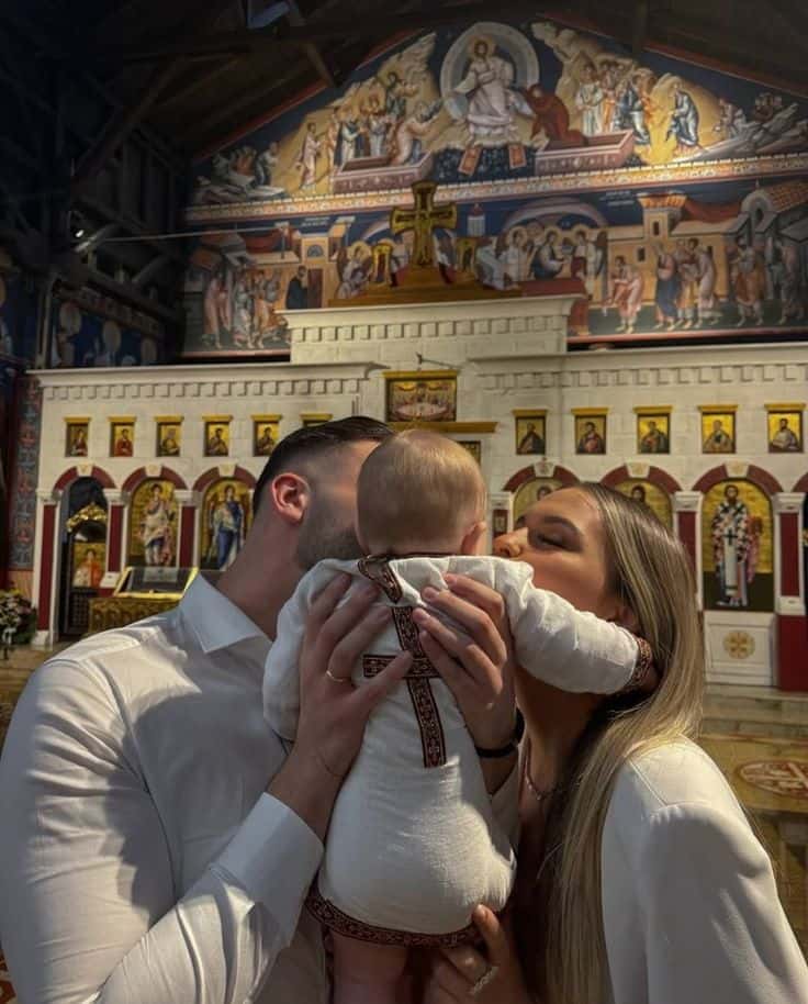A family at a baptism in an Orthodox church