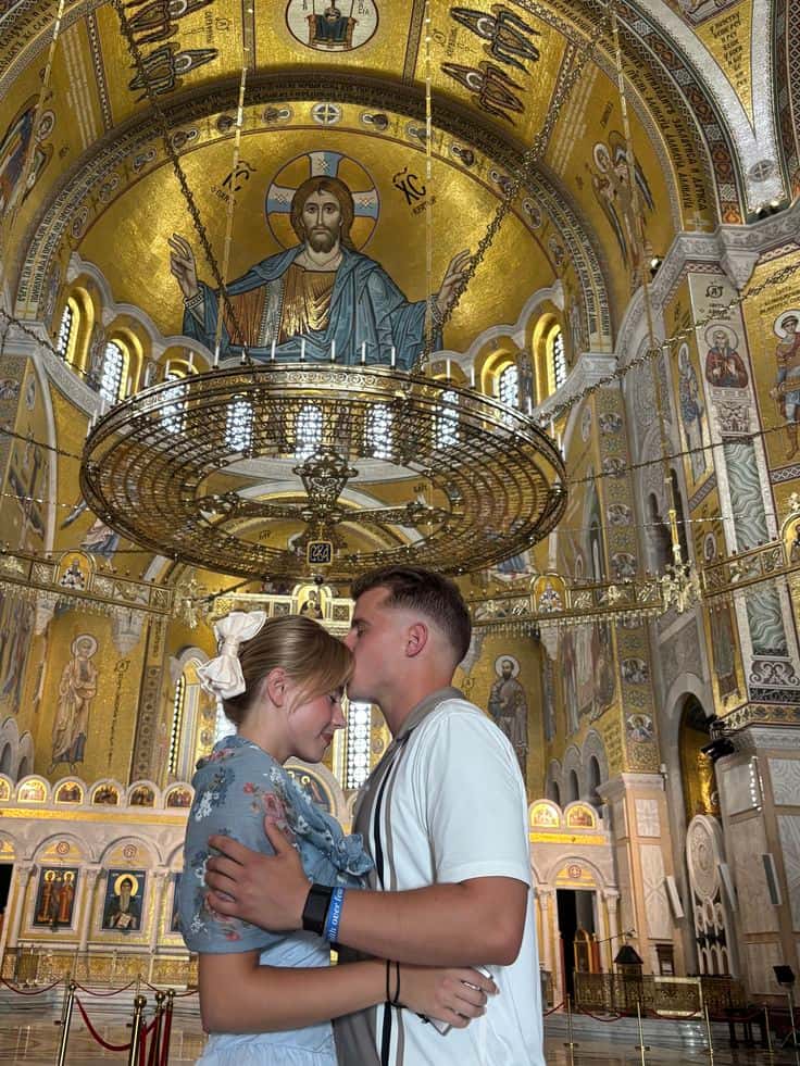 A couple inside a cathedral